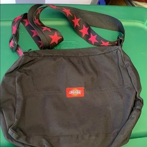 Dickies purse with adjustable strap.